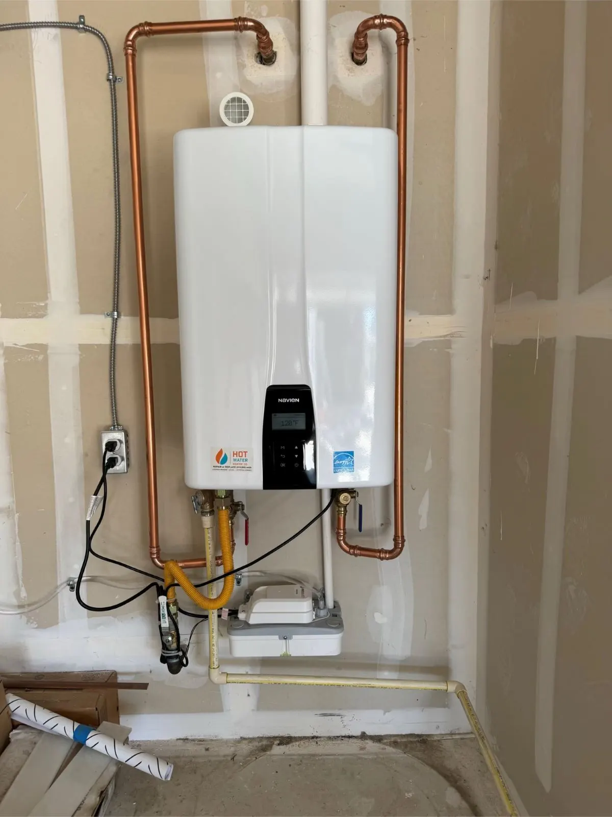 Navien tankless water heater with copper piping professionally installed by HOTCO